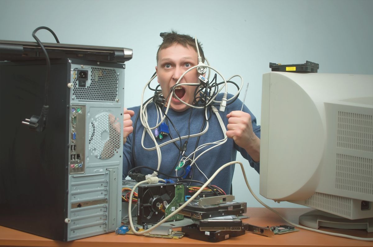 Overloaded computer repairman tired from his work and goes crazy. Computer technician. PC repair service center.